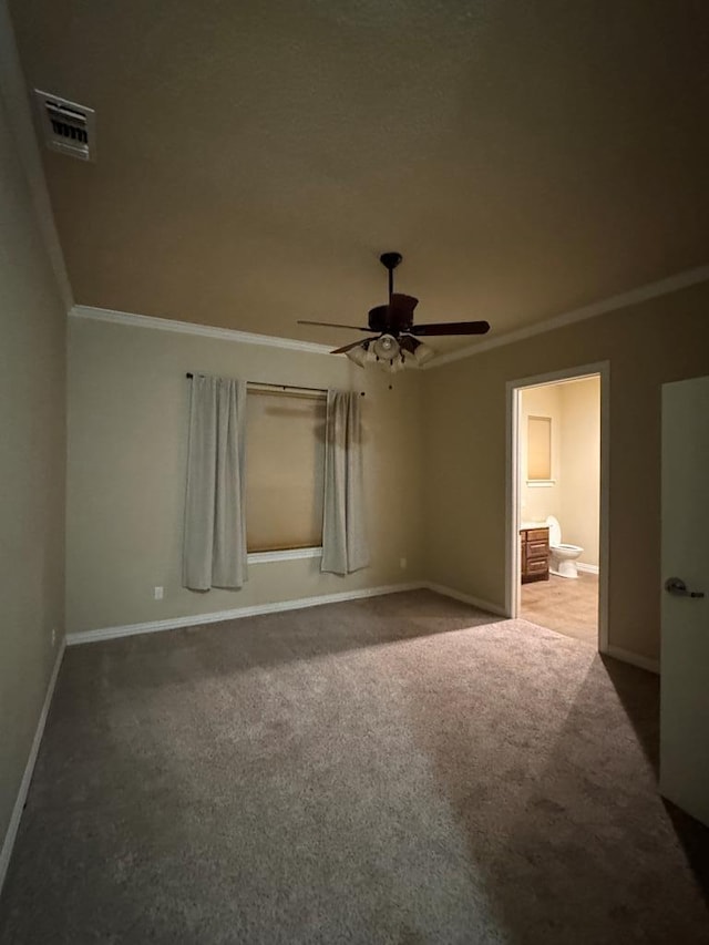 unfurnished bedroom with crown molding, carpet, ceiling fan, and ensuite bath