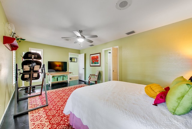 bedroom with ceiling fan, baseboards, and visible vents