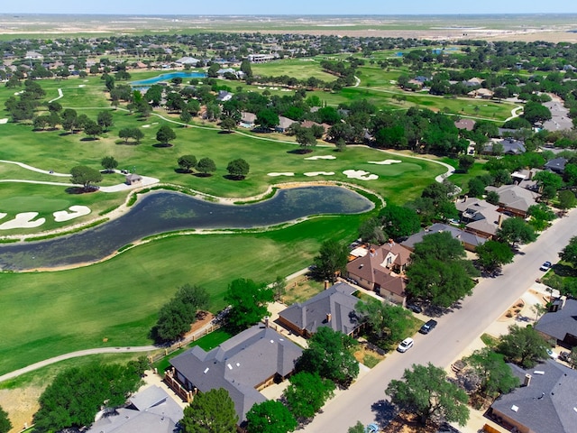 bird's eye view featuring golf course view, a water view, and a residential view