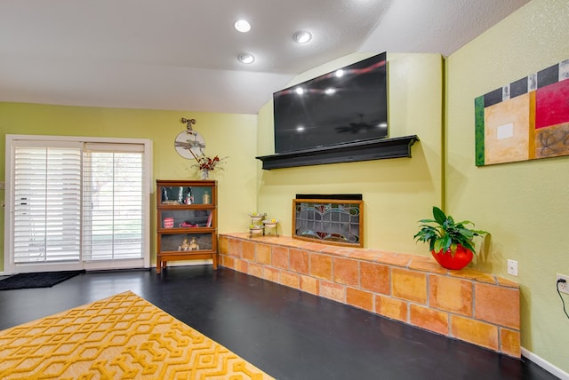 living room with a fireplace, baseboards, and recessed lighting