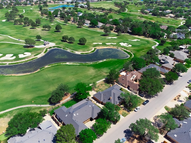 bird's eye view with a water view, golf course view, and a residential view