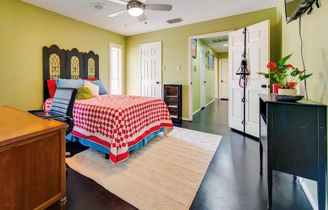 bedroom with finished concrete floors, baseboards, a ceiling fan, and visible vents
