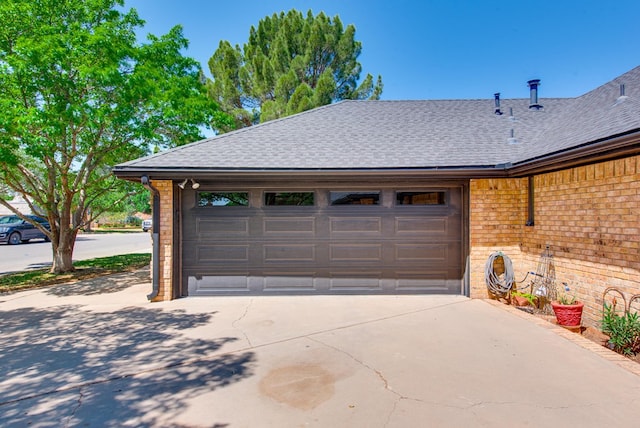 garage with concrete driveway