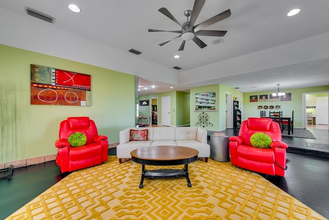 living area featuring recessed lighting, visible vents, and ceiling fan with notable chandelier