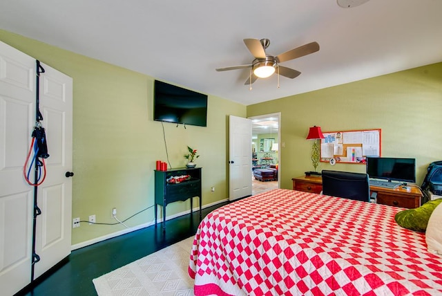 bedroom featuring baseboards and a ceiling fan