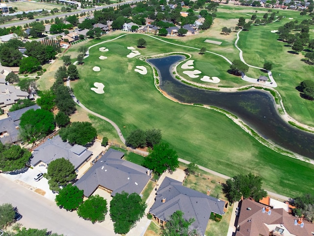 birds eye view of property with view of golf course and a residential view