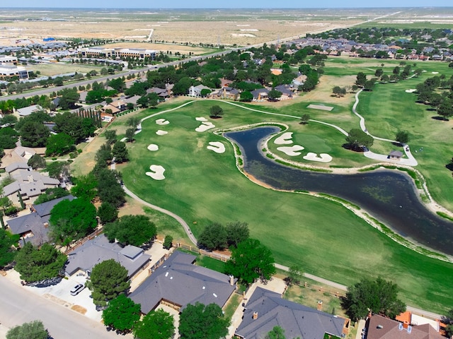 drone / aerial view featuring golf course view and a residential view
