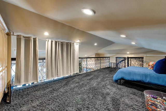 bedroom featuring carpet flooring and lofted ceiling