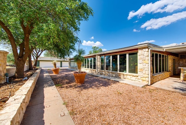 view of front of home featuring an outbuilding and a garage