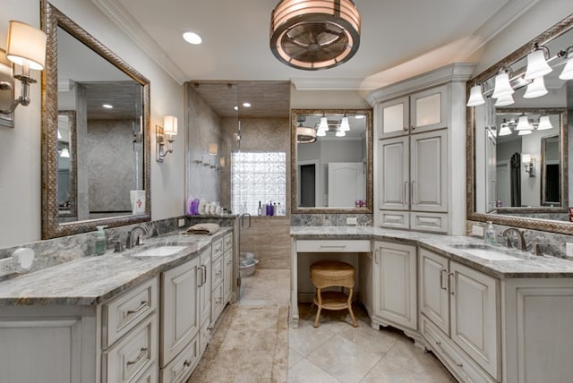 bathroom featuring crown molding, tile patterned flooring, and vanity