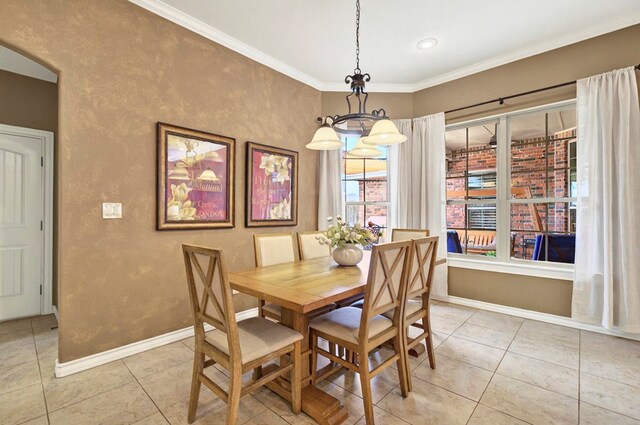 1302 Telluride Dr, Midland, TX 79705 - dining room with light tile patterned floors, baseboards, and crown molding