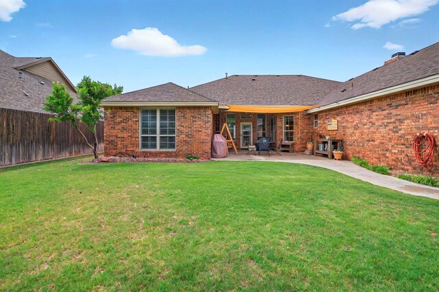 1302 Telluride Dr, Midland, TX 79705 - back of property featuring a patio and brick siding