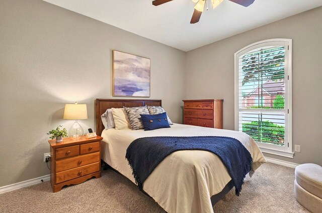 1302 Telluride Dr, Midland, TX 79705 - carpeted bedroom with baseboards and ceiling fan