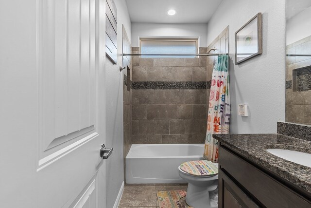 7104 Mcpherson Ln, Midland, TX 79706 - bathroom with toilet, vanity, shower / tub combo with curtain, and baseboards