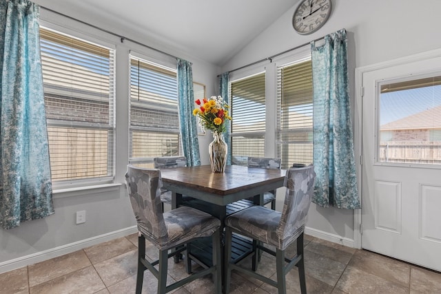 7104 Mcpherson Ln, Midland, TX 79706 - tiled dining area featuring lofted ceiling and baseboards