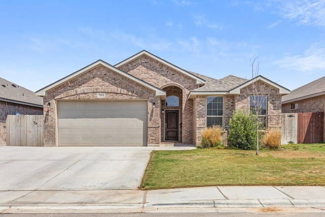 7104 Mcpherson Ln, Midland, TX 79706 - view of front facade with brick siding, a garage, and concrete driveway