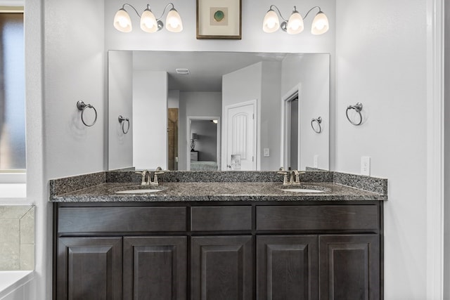 7104 Mcpherson Ln, Midland, TX 79706 - bathroom featuring double vanity and a bathtub