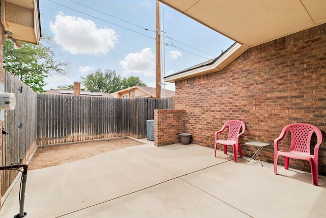 1601 Monterrey Dr, Midland, TX 79703 - view of patio with central AC unit and a fenced backyard