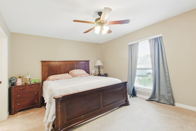 1601 Monterrey Dr, Midland, TX 79703 - bedroom featuring light colored carpet, baseboards, and ceiling fan