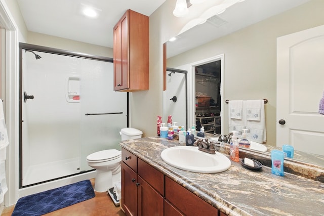 1601 Monterrey Dr, Midland, TX 79703 - full bath with a shower stall, vanity, toilet, and recessed lighting