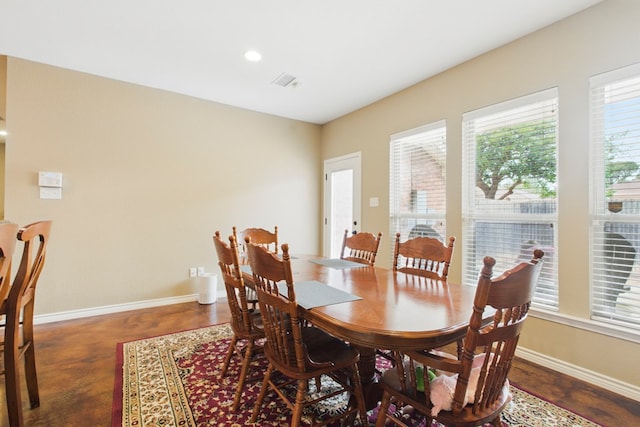 1601 Monterrey Dr, Midland, TX 79703 - dining area featuring baseboards, concrete flooring, and recessed lighting