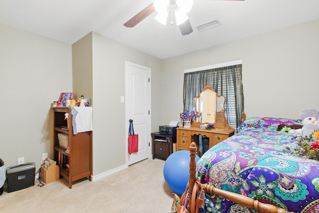 1601 Monterrey Dr, Midland, TX 79703 - bedroom featuring light carpet, ceiling fan, and baseboards