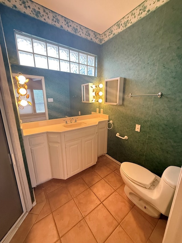 4805 Spring Meadow Ln Unit 6, Midland, TX 79705 - bathroom featuring tile patterned floors, toilet, and vanity