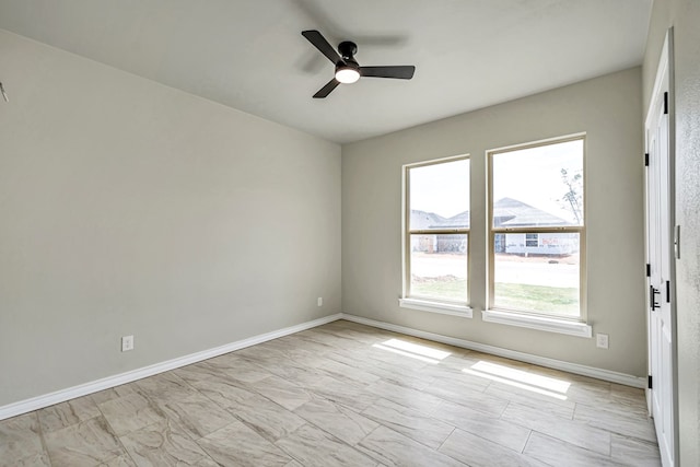 spare room featuring ceiling fan