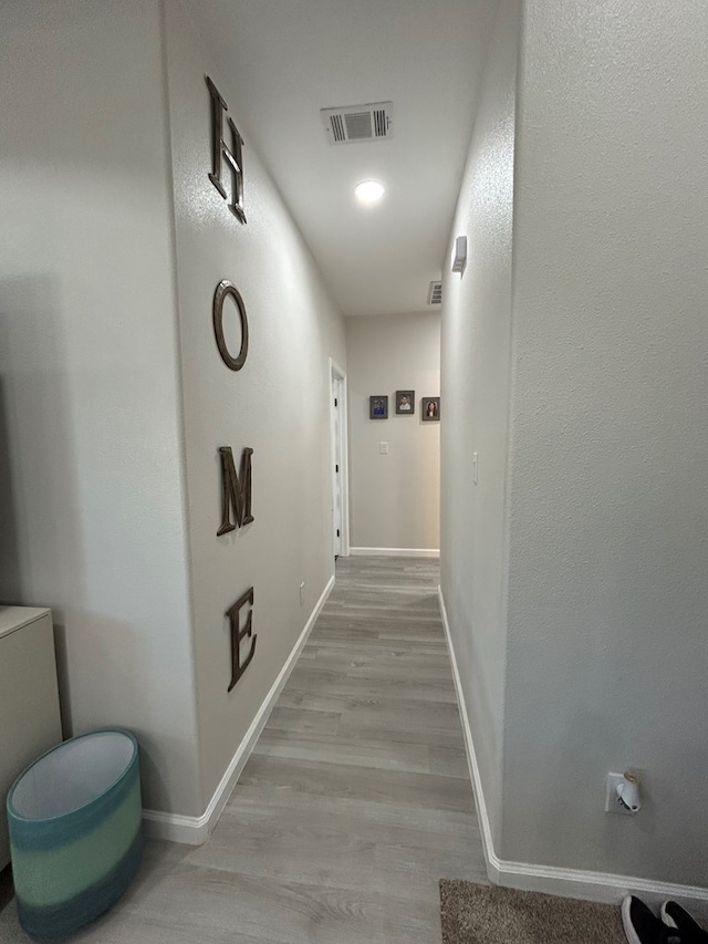 hallway featuring light hardwood / wood-style flooring