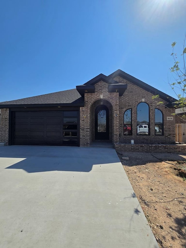 view of front of property with a garage