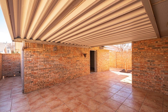 view of patio featuring fence