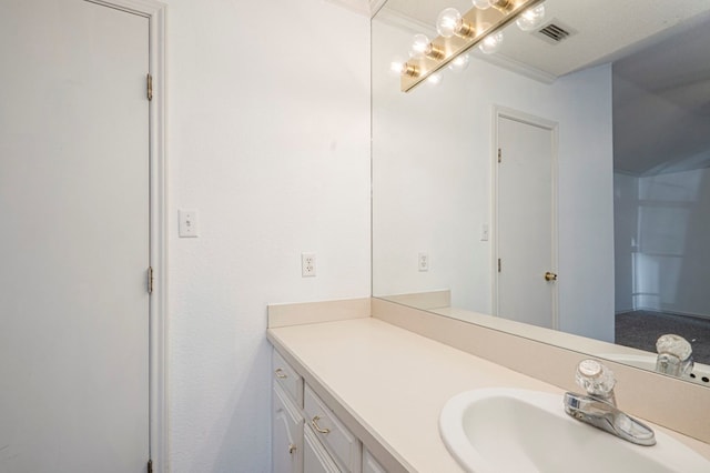 bathroom featuring vanity and visible vents