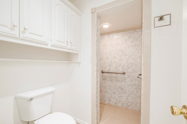 full bathroom featuring toilet and a shower