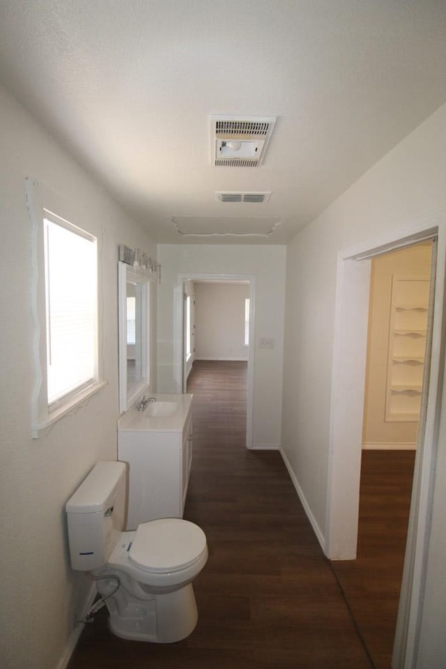 309 W Estes Ave, Midland, TX 79701 - half bathroom featuring wood finished floors and vanity