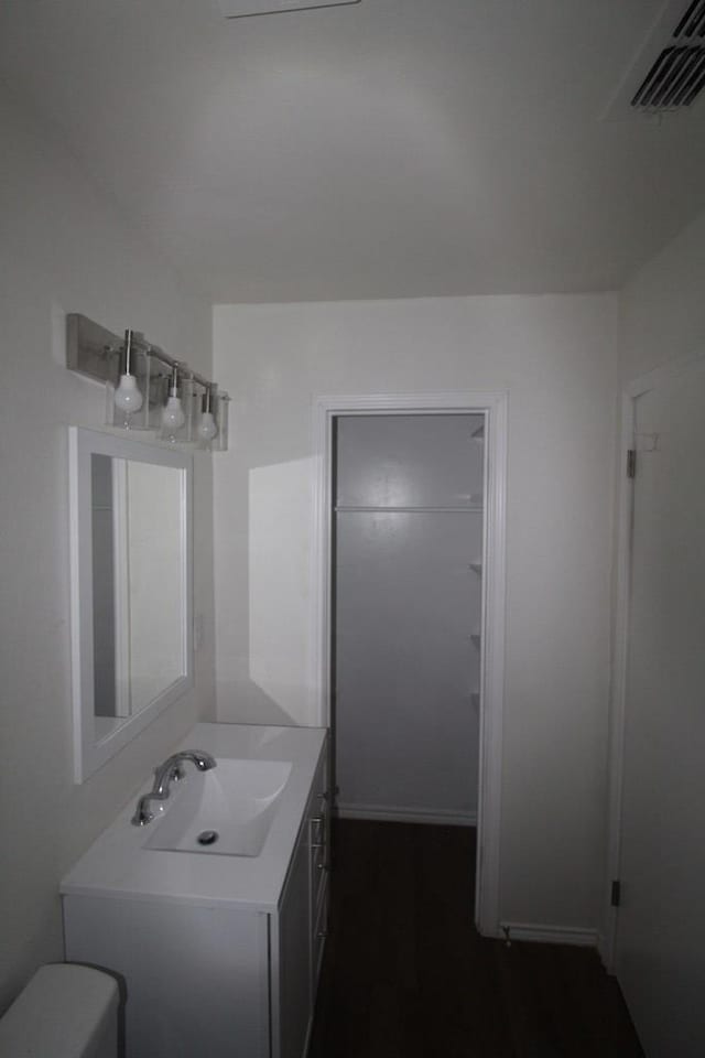 309 W Estes Ave, Midland, TX 79701 - bathroom featuring vanity and wood finished floors