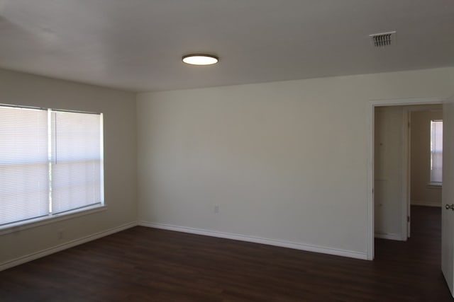 309 W Estes Ave, Midland, TX 79701 - empty room with dark wood finished floors and healthy amount of natural light