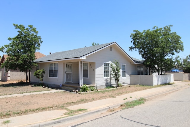 309 W Estes Ave, Midland, TX 79701 - ranch-style house featuring covered porch and roof with shingles