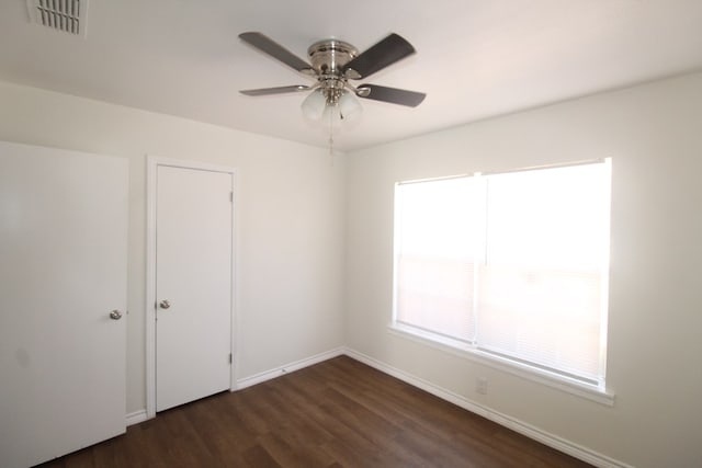 309 W Estes Ave, Midland, TX 79701 - unfurnished bedroom featuring dark wood-style flooring and ceiling fan