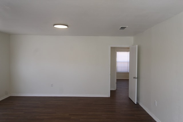 309 W Estes Ave, Midland, TX 79701 - spare room featuring dark wood finished floors and baseboards
