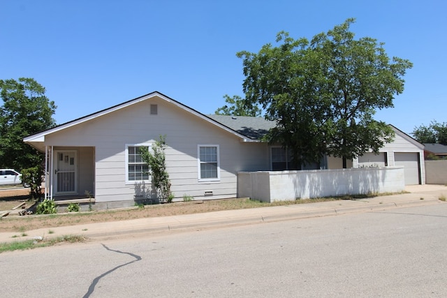309 W Estes Ave, Midland, TX 79701 - ranch-style home featuring a garage and driveway