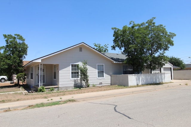 309 W Estes Ave, Midland, TX 79701 - view of front facade with driveway, a porch, and roof with shingles