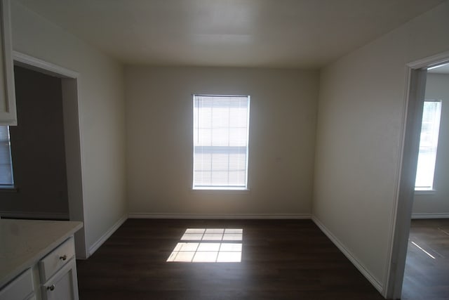309 W Estes Ave, Midland, TX 79701 - empty room with dark wood-style floors and baseboards