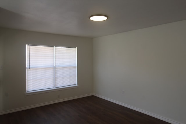 309 W Estes Ave, Midland, TX 79701 - unfurnished room featuring dark wood-style flooring and baseboards