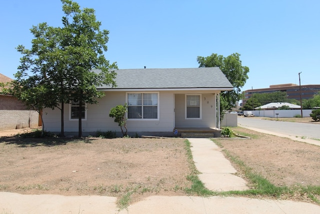 309 W Estes Ave, Midland, TX 79701 - view of front of house featuring a porch and a shingled roof