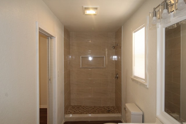 309 W Estes Ave, Midland, TX 79701 - bathroom with toilet and tiled shower