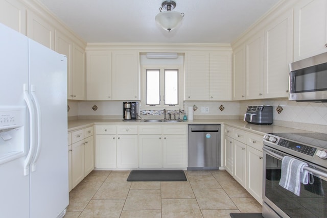 kitchen featuring backsplash, sink, light tile patterned floors, and stainless steel appliances