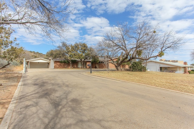 ranch-style home featuring a garage