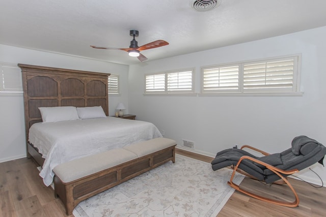 bedroom featuring light wood-type flooring and ceiling fan