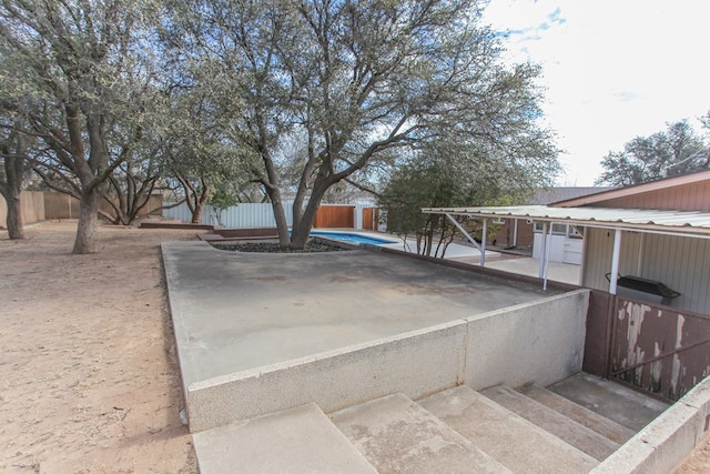 view of storm shelter featuring a patio area