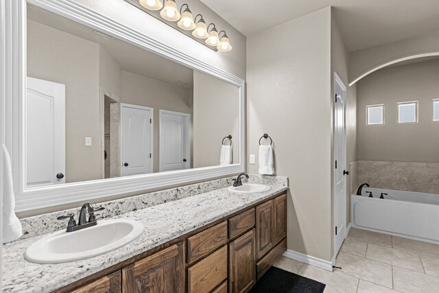 3101 Fairfield Ln, Midland, TX 79705 - full bath with tile patterned flooring, double vanity, and a garden tub